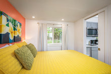 Load image into Gallery viewer, Master bedroom with queen bed and blackout curtains.
