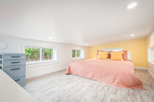 Load image into Gallery viewer, Queen bed in loft area above the bathroom.
