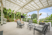 Load image into Gallery viewer, Outdoor seating and firepit on lanai
