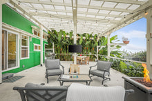 Load image into Gallery viewer, Spacious outdoor living. Lanai living room and dining room.
